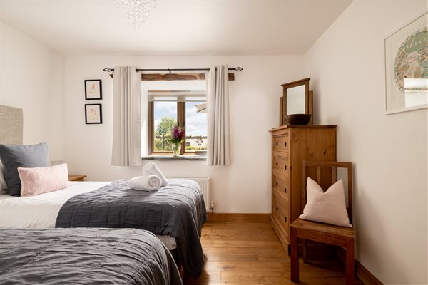 Bedroom with beds arranged as a twin room.